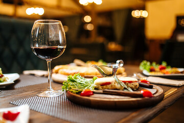 Evening celebration dinner with wine on blurry background