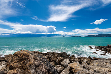 Fototapeta na wymiar Seascape in the Gulf of La Spezia with beautiful storm clouds on the horizon, in front of the ancient village of Tellaro, Lerici Municipality, La Spezia province, Liguria, Italy, Southern Europe.
