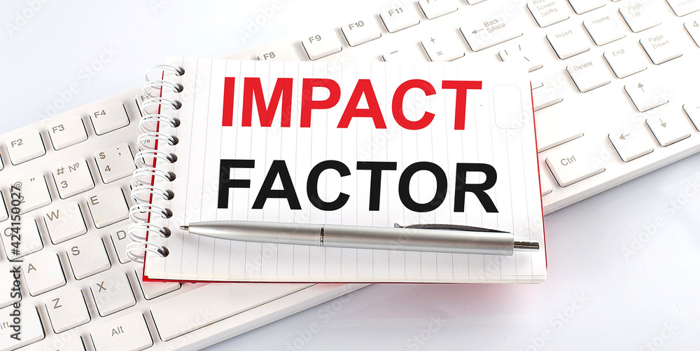 Aufkleber text impact factor on keyboard on the white background