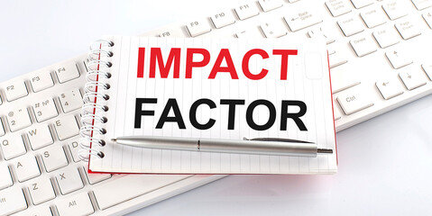 text IMPACT FACTOR on keyboard on the white background