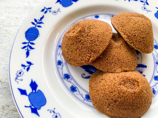 Putu Cangkir is a traditional snack from Makassar, South Sulawesi, Indonesia. Made from sticky rice, brown sugar, filled with grated coconut and covered with pandan leaves.