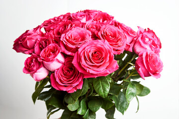 Bouquet of pink roses on white background with copy space
