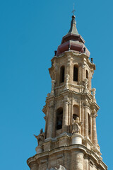 Obraz premium Dome of church named Exaltation of the Holy Cross in Zaragoza, Aragon, Spain. Baroque architecture, Neo-Mudajar style. Blue clear sky