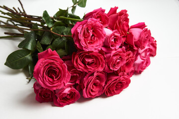Bouquet of pink roses on white background with copy space