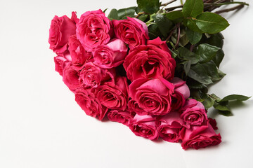 Bouquet of pink roses on white background with copy space