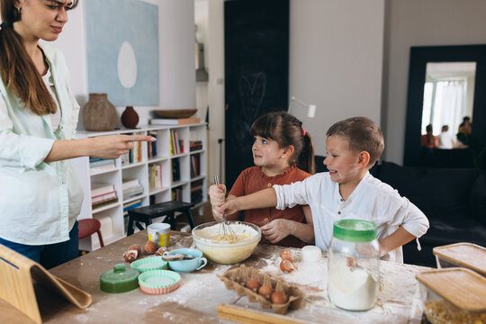 mother scold her kids for mess they made baking at home