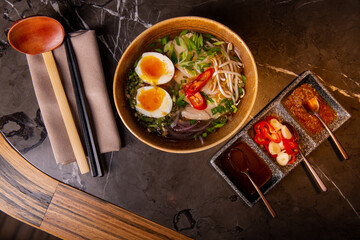 Vietnamese Pho soup. Hearty Asian soup. Asian cuisine. Delicious soup with noodles, chicken and...