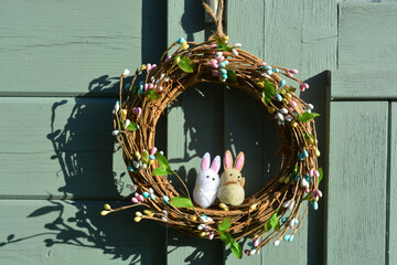 easter wreath with toy rabbit decorations