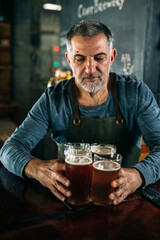 bartender serving beer in pub