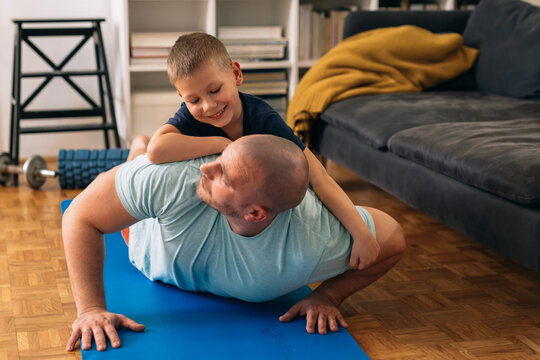 father workout training at home with his son