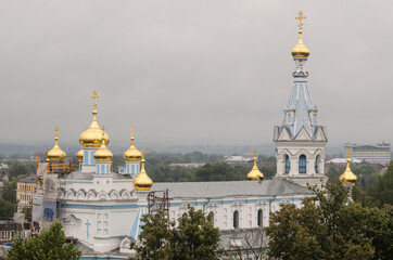 Fototapeta na wymiar Daugavpils Borisoglebskiy Orthodox Cathedral, Latvia. Church with golden domes.