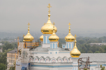 Fototapeta na wymiar Daugavpils Borisoglebskiy Orthodox Cathedral, Latvia. Church with golden domes.