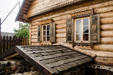 Fototapeta premium Russian Old Believers village in Latvia, Slutiski. Beautiful wooden house.