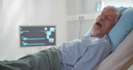 Side view of senior male patient dead in hospital bed