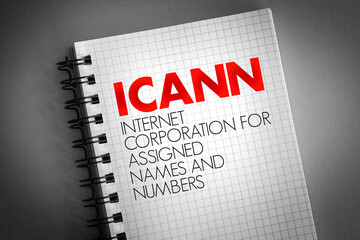 ICANN - Internet Corporation for Assigned Names and Numbers acronym on notepad, technology concept background