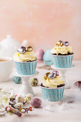 Spring Easter cupcakes  and easter eggs on the  white table.  Easter concept