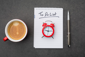 The to do list with cup of coffee and a clock as a time management concept