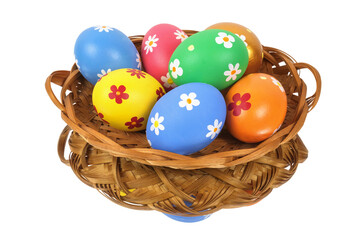 Colorful painted Easter eggs in the basket reflecting on the white background, isolated