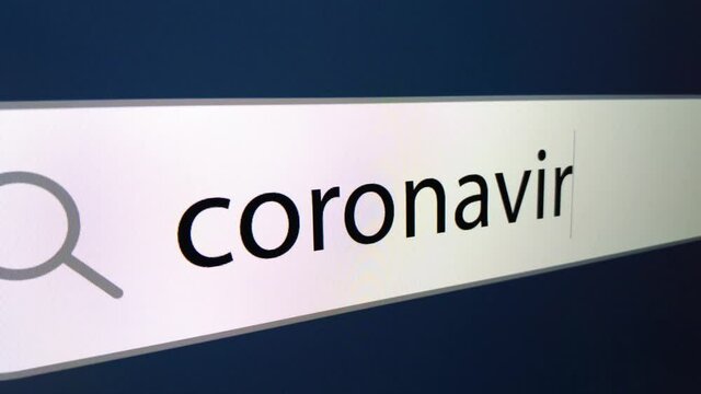 Coronavirus at the end a question mark is written in the search bar with a cursor, computer monitor, close-up with the effect of a camera zoom