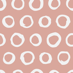 Hand drawn seamless vector pattern with abstract circles. Trendy colored vector background for prints, textile and wallpaper. Modern backdrop in grunge style. Simple decorative dots pattern