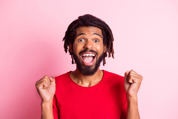 Photo of young black woman happy positive smile celebrate win victory fists hands isolated over pastel color background