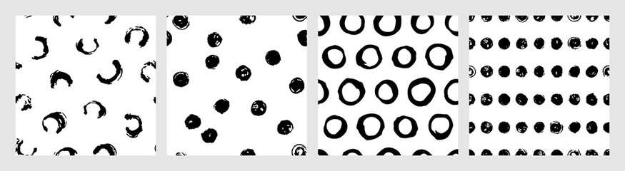 Set of ink dots vector seamless patterns. Hand drawn brush polka dots backdrop. Doodle illustration for wrapping paper and fabric. Contemporary monochrome collection with polka dots patterns