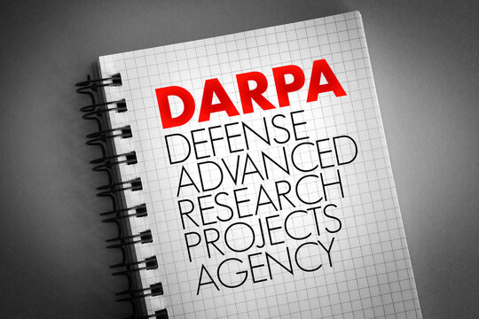 DARPA - Defense Advanced Research Projects Agency acronym on notepad, concept background