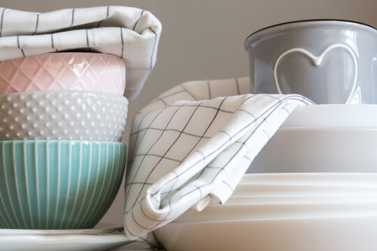 group of different dishes and kitchen textiles. plates, bowls, Cup, towel