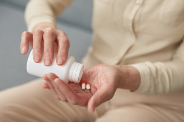 Pills in a senior's hands. Painful old age. Caring for the health of the elderly