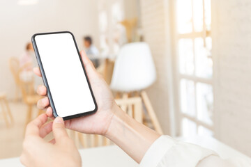 cell phone blank white screen mockup.woman hand holding texting using mobile on desk at office.background empty space for advertise.work people contact marketing business,technology