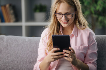 Smiling woman using tablet