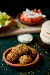 falafel, lettuce, onion, tomato and pita bread