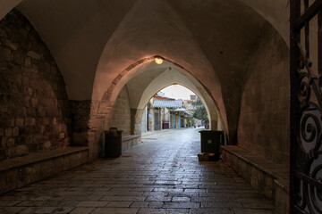 Deserted Muristan street in the early morning on a rainy day in the old city of Jerusalem, in Israel