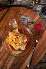 Pieces of herring in olive oil.