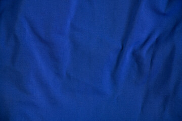 dark blue soft crumpled fabric as background close up © Виктория Котлярчук