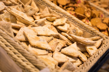 crispy cookies in wicker baskets on the counter