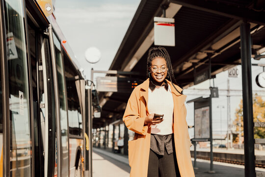Young woman waiting at bus station