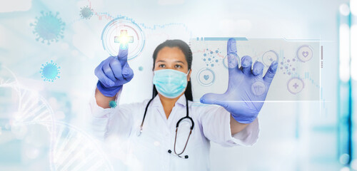 Fototapeta premium Innovation and Medical technology concept. Doctor push the medicine button with computer interface to prevent and cure coronavirus or covid-19.