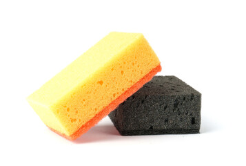 porous sponges for washing dishes isolated on white background. black and yellow kitchen sponges.