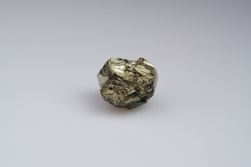 Natural gemstone pyrite on white background