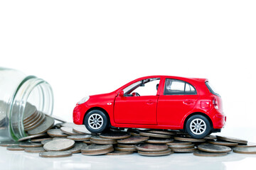 Miniature car model and Financial with coins. Finance and car loan, saving money for a car.