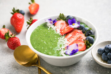Colorful, healthy food. Acai green smoothie bowl. Keto breakfast idea.