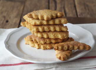 Homemade honey shortbread cookies with carved edges on a wooden background.Healthy natural food.
