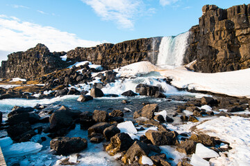 Winter Landscape - River and waterfall in Thingvellir National Park. Iceland