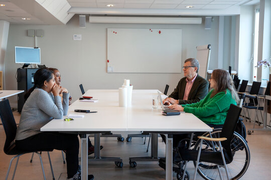 Disabled woman during meeting in office