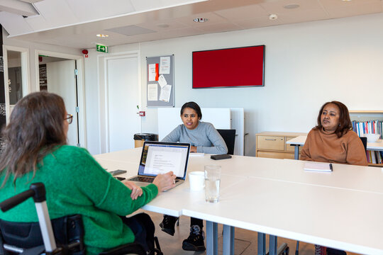 Disabled woman during meeting in office
