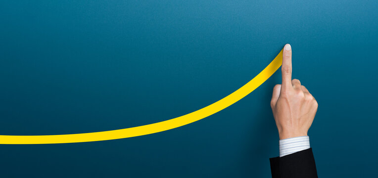 Businessman plan the growth and development, businessman hand drawn a yellow line up