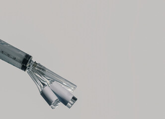 Ampoules with medicine for the virus and a syringe for vaccination, there is a place to insert text.