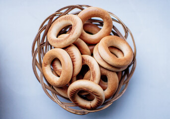 Fototapeta premium bagels in a wicker basket on a white background, isolate. Tea Party Concept