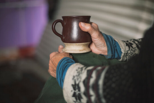 Woman's hand holding mug
